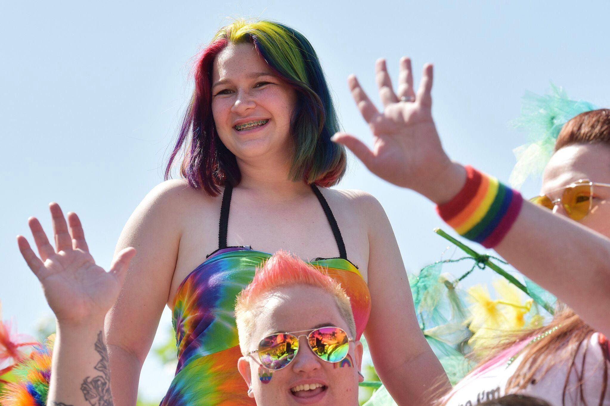 Molly Pinta, center, aboard a float during Buffalo Grove’s inaugural Pride Parade, 2019. Photo by Karie Angell Luc
