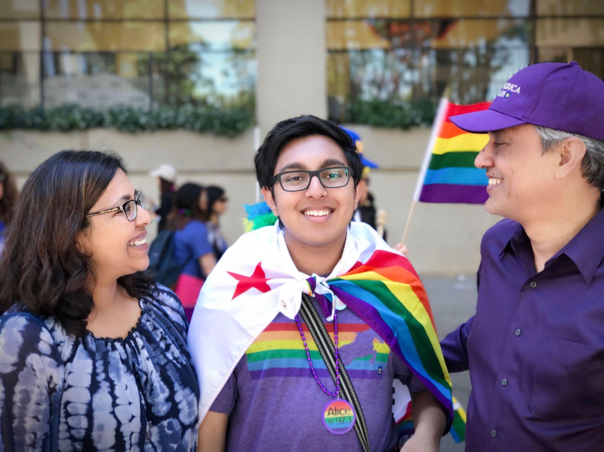 Sameer Jha, center, with parents Charmaine Hussain, left, and Sudhir Jha, right, at the 2017 San Francisco Pride Parade. Photo courtesy of Sameer Jha 