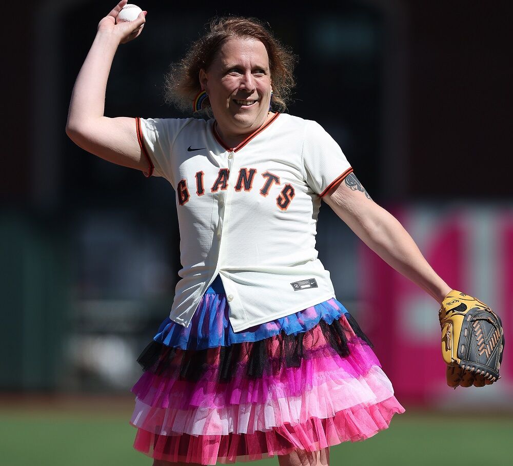 SAN FRANCISCO, CALIFORNIA - JUNE 11: Amy Schneider throws out the ceremonial first pitch
