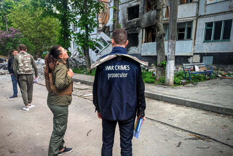 War crimes investigators working the scene of an alleged atrocity.