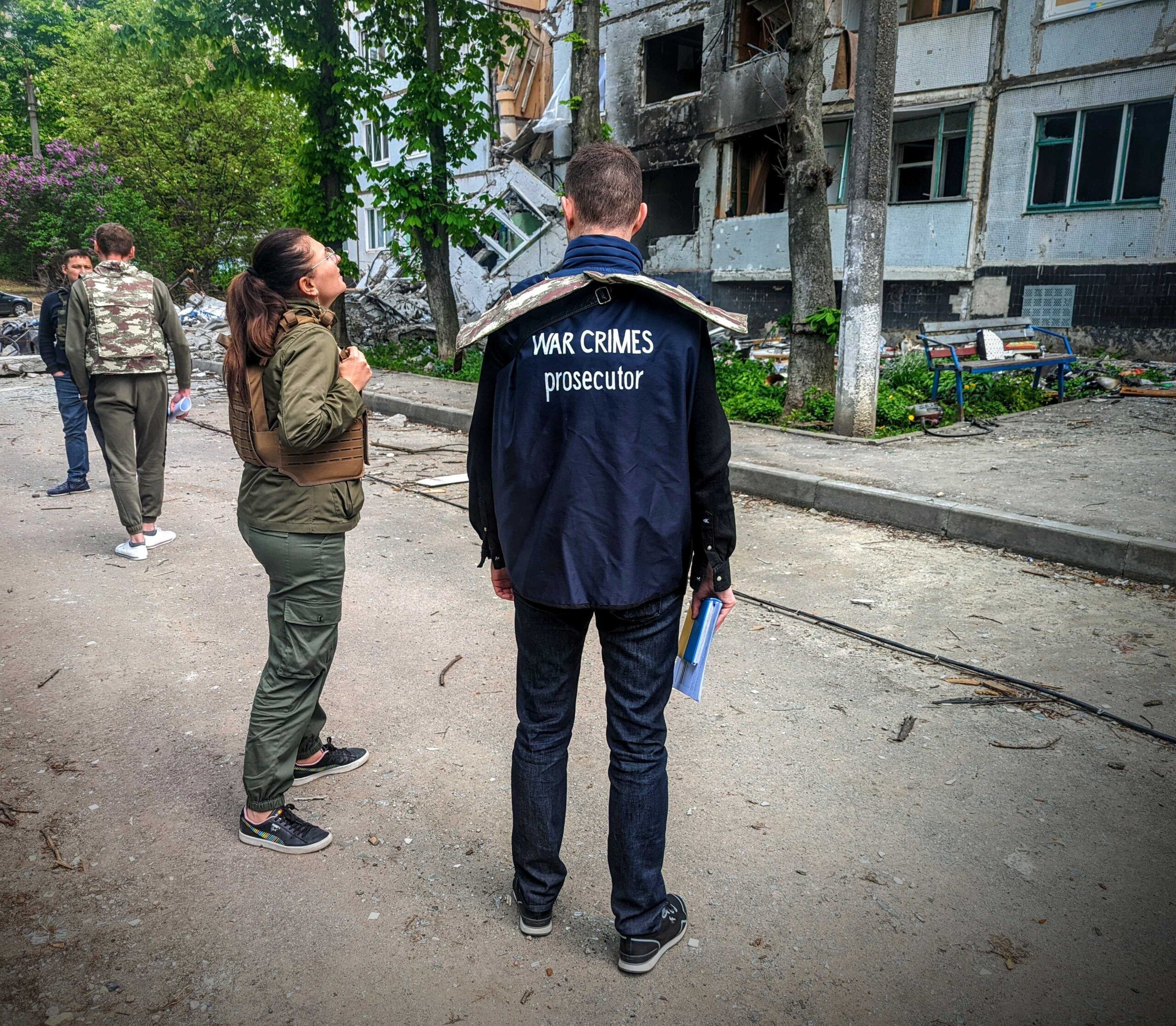 War crimes investigators working the scene of an alleged atrocity.