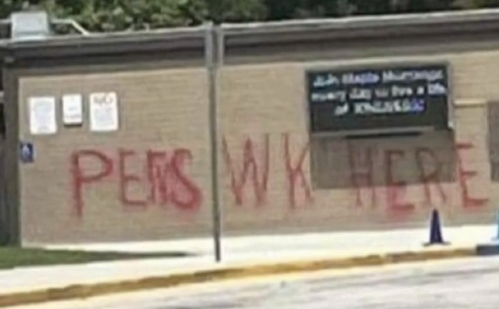 The graffiti at the elementary school said "PERVS WORK HERE"
