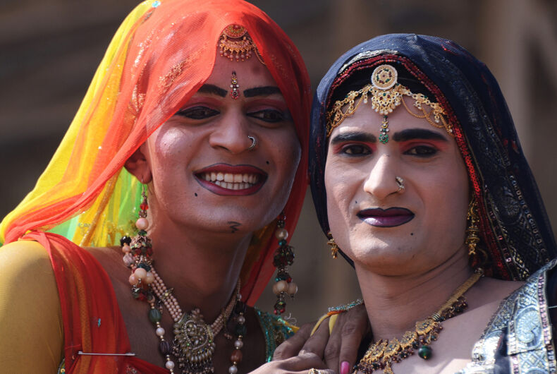 Unidentified hijras - holy people,so called "third gender" dressed as woman at Pushkar camel fair on November 12, 2013 in Pushkar,India.