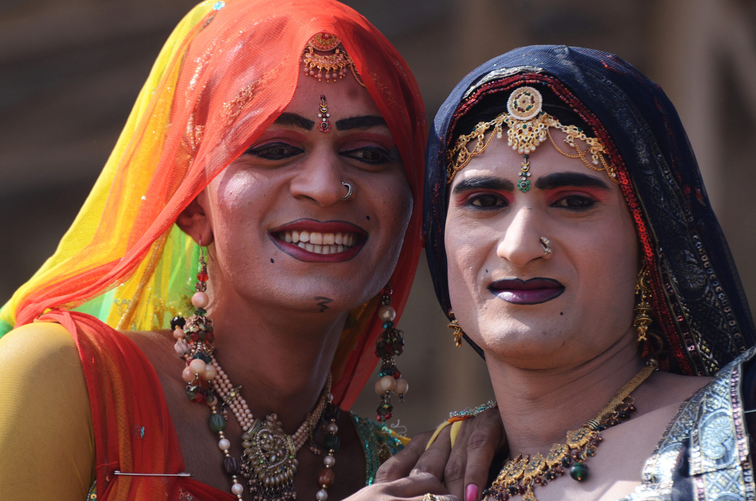 Unidentified hijras - holy people,so called "third gender" dressed as woman at Pushkar camel fair on November 12, 2013 in Pushkar,India.