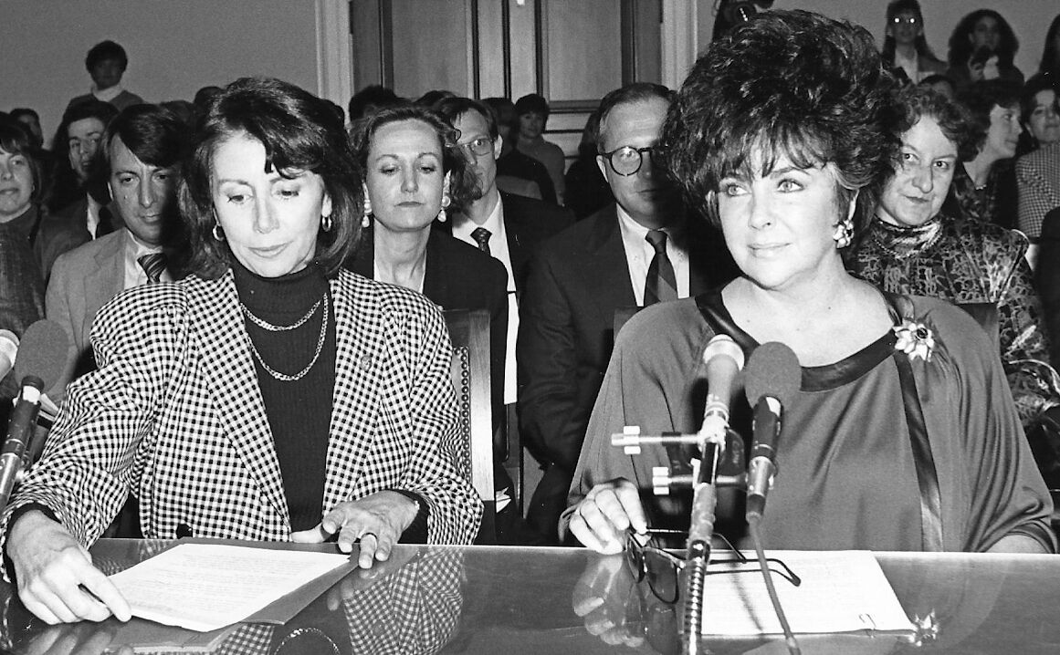 nancy-pelosi-and-elizabeth-taylor-testifying-before-the-house-budget-committee-on-hiv-aids-funding
