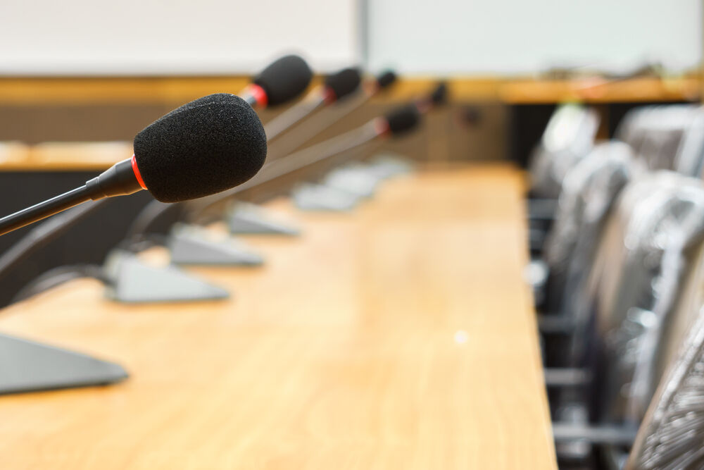 a board room with mics