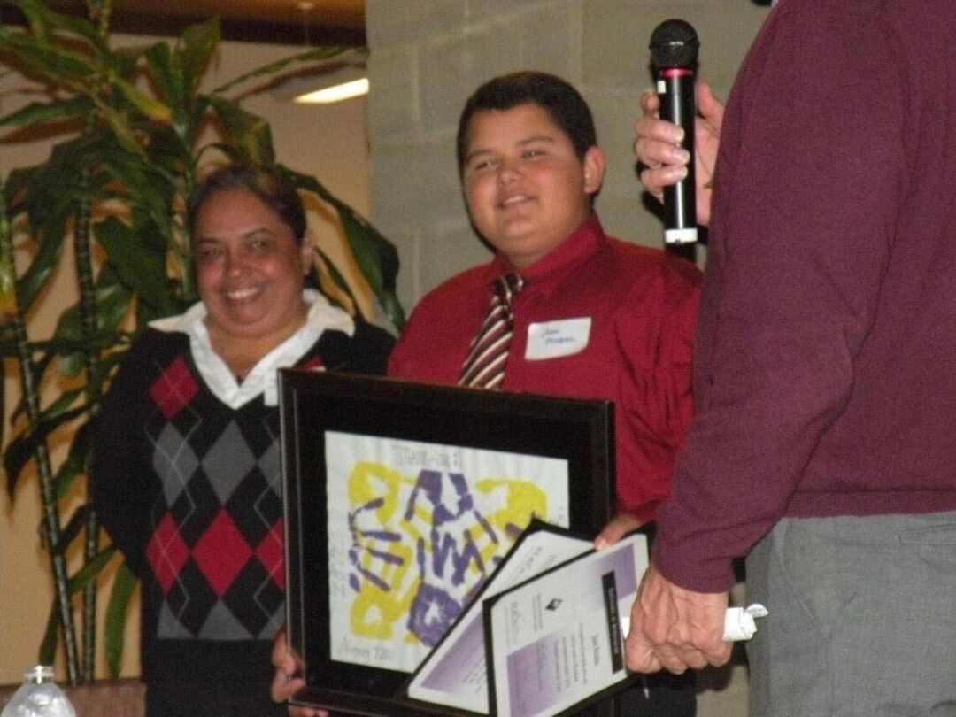 Acosta received an award in recognition of his volunteer work with Woodland Coalition for Youth. Photo provided by Juan Acosta.