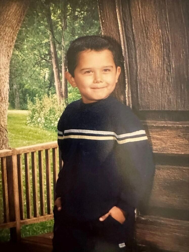 Acosta poses for his school’s picture day in first grade in 2003. Photo provided by Juan Acosta. 