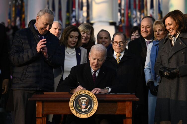 US President Joe Biden signs the Respect for Marriage Act at the White House in Washington, DC.