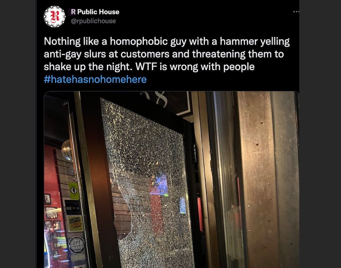 The shattered door of Chicago's R Public House after a man shouting homophobic slurs smashed it with a hammer
