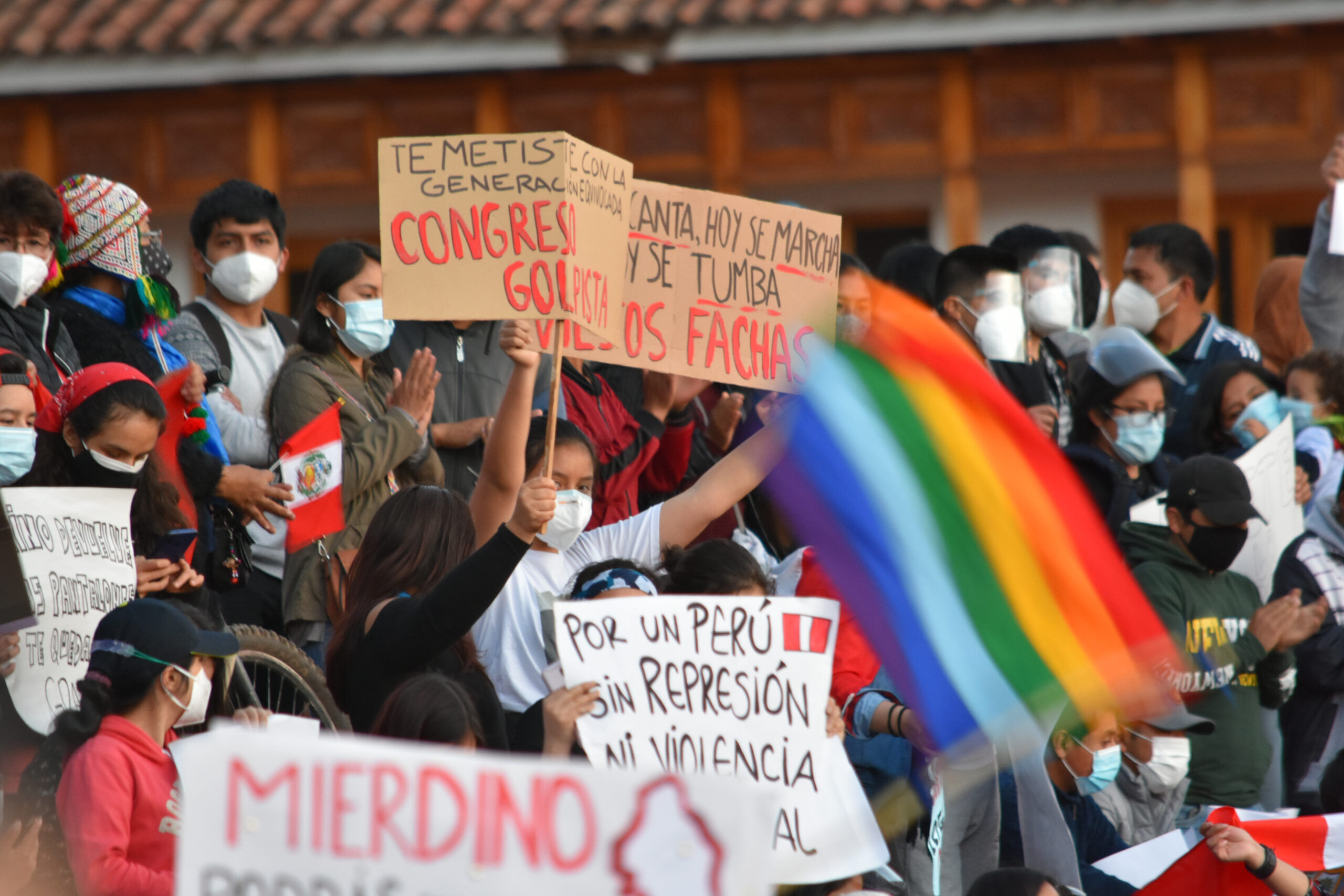CUSCO, PERU: 11/14/2020 : Protestors wave a rainbow flag at Plaza de Armas after Congress removed President Martín Vizcarra from office.