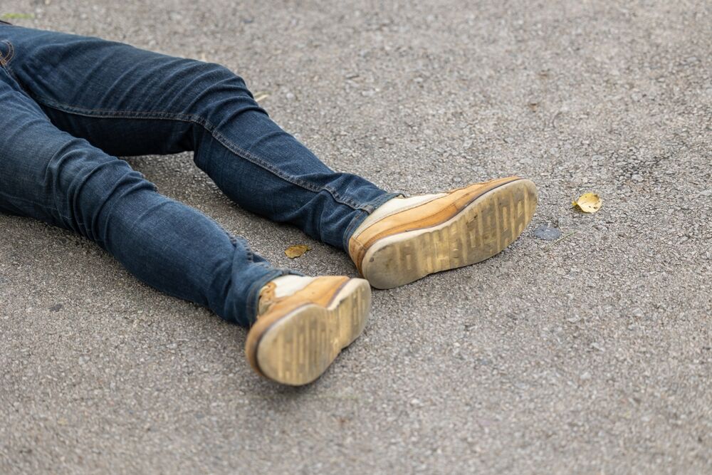 a man beaten in the street, passed out