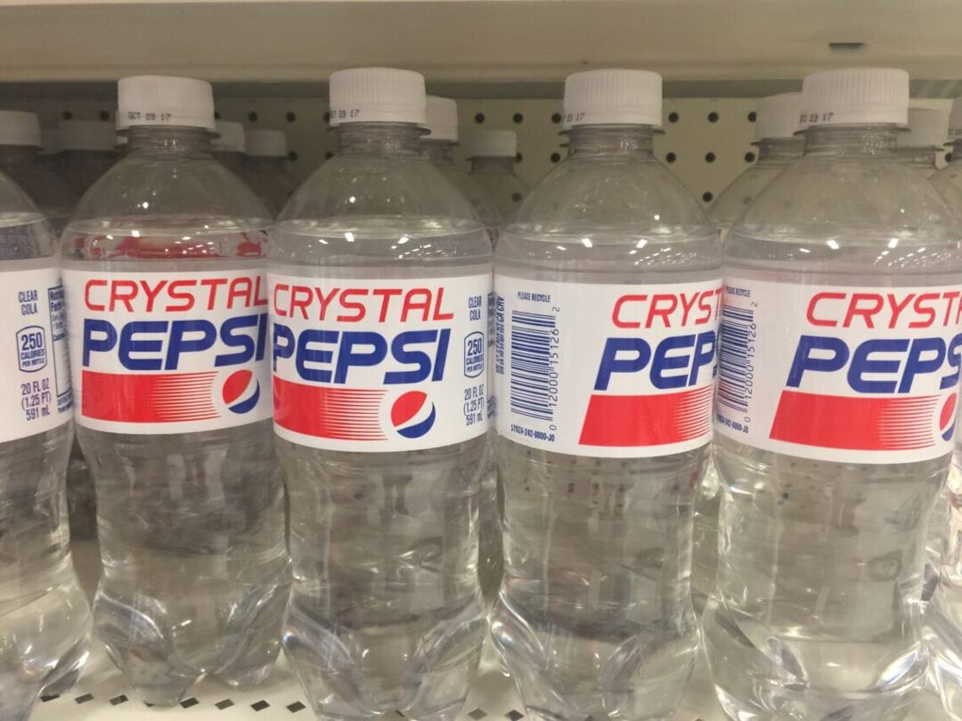 Bottles of Crystal Pepsi on a shelf in the 1990s