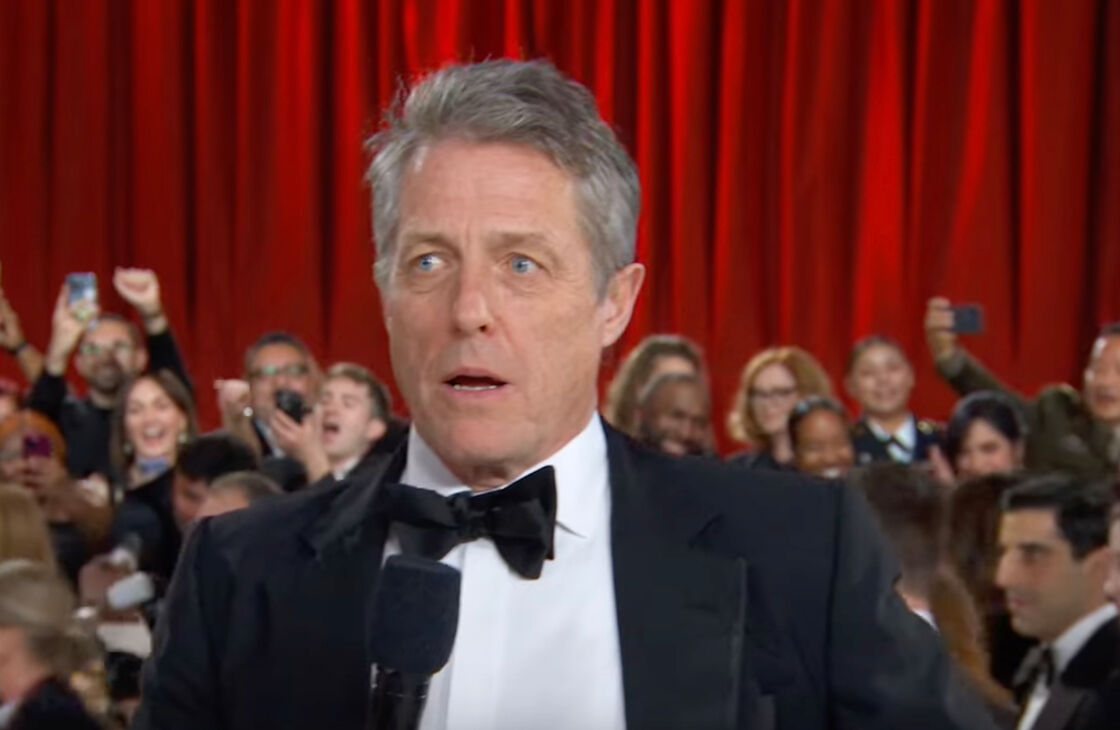 A close read of Hugh Grant’s painfully awkward Oscars red carpet interview