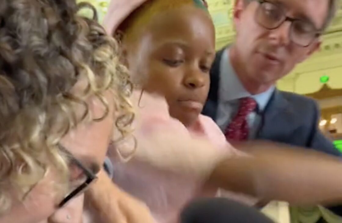 Activist protects speaker at Texas hearing delivering a powerful message about trans humanity