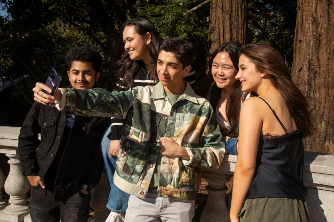 Arujo and friends at the bridge over Strawberry Creek, leading to the center of the University of California, Berkeley campus. Photo by Marcel Pardo Ariza for LGBTQ Nation