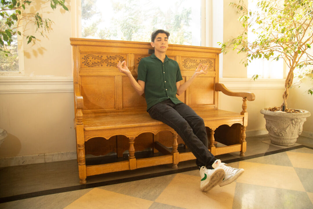 Joseph Arujo finds his sweet spot in a secret hallway at UC Berkeley's library. Photo by Marcel Pardo Ariza for LGBTQ Nation