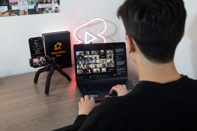 Joseph Arujo creates a social media post using his laptop and phone. Technology is one way today’s queer youth are staying connected and maintaining positive mental health. Photo by Marcel Pardo Ariza for LGBTQ Nation