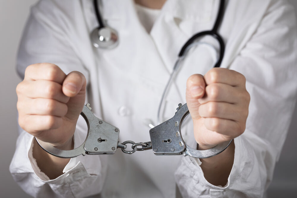 An arrested doctor, a stock image