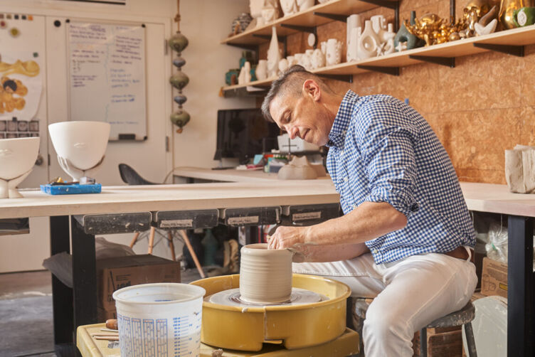 Jonathan Adler is still hands-on in the creation of his signature pottery pieces. His SoHo, New York, workshop space includes a pottery wheel and kiln. Photo by Seth Caplan for LGBTQ Nation