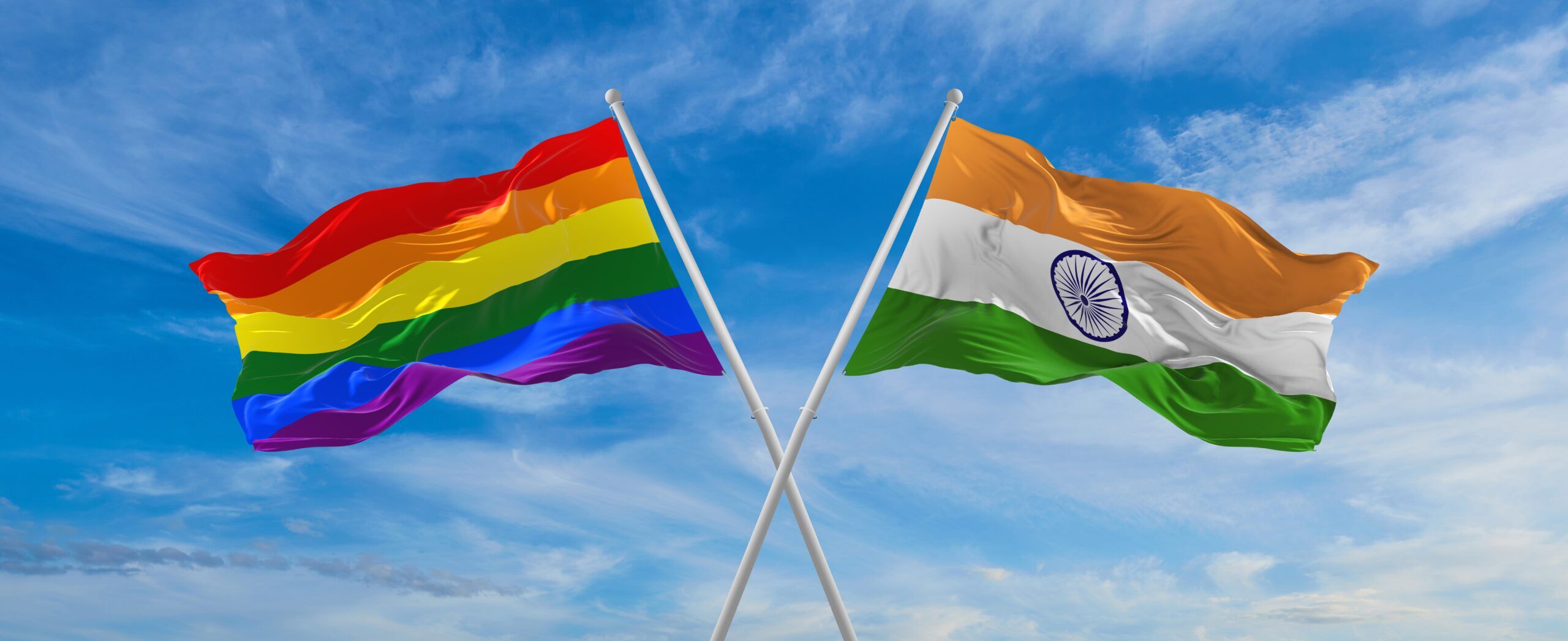 crossed flags of lgbt and India flag waving in the wind at cloudy sky. Freedom and love concept. Pride month. activism, community and freedom Concept. Copy space. 3d illustration