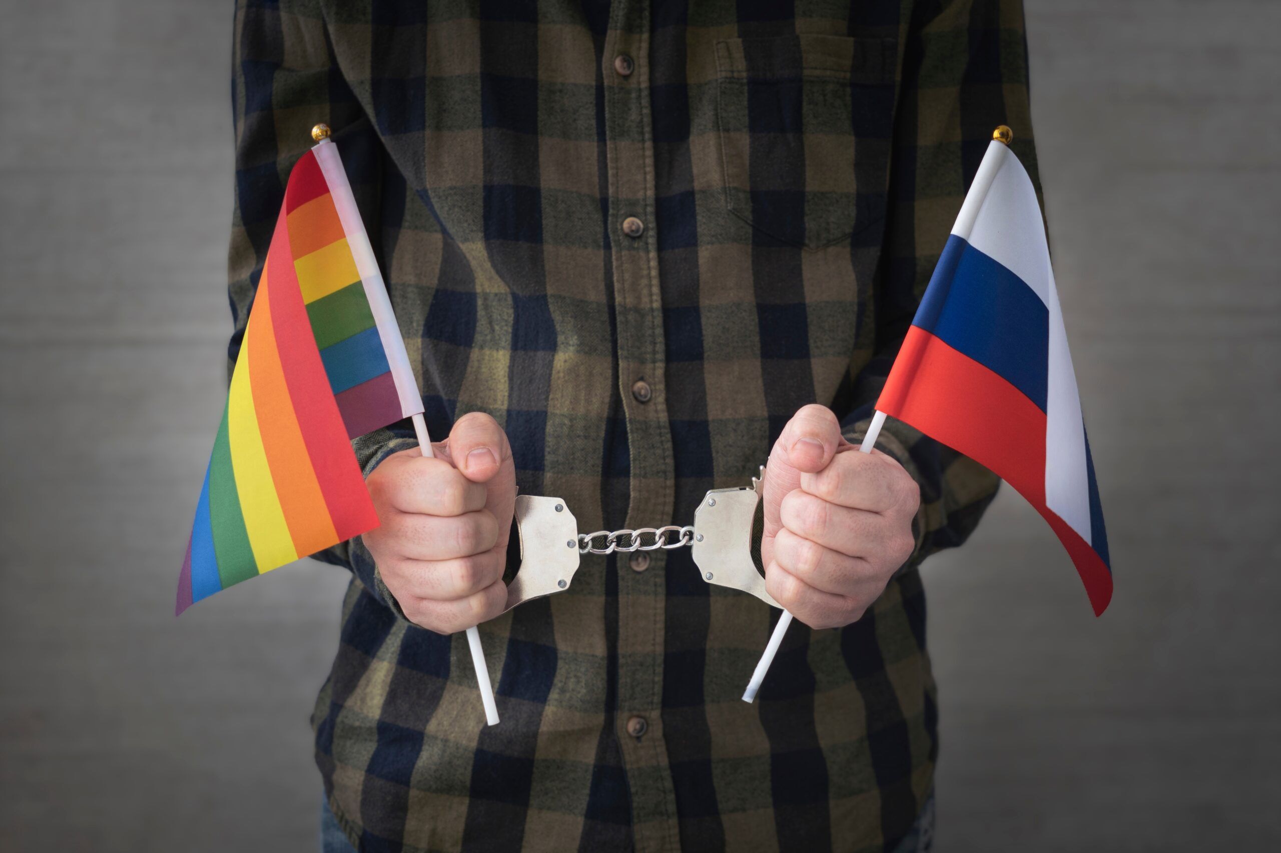 Russia anti-LGBTQ+ propaganda law, gay arrest, sex, German man, Handcuff,,Russian,Flag,And,Flag,Of,Lgbt.,The,Problem,Of