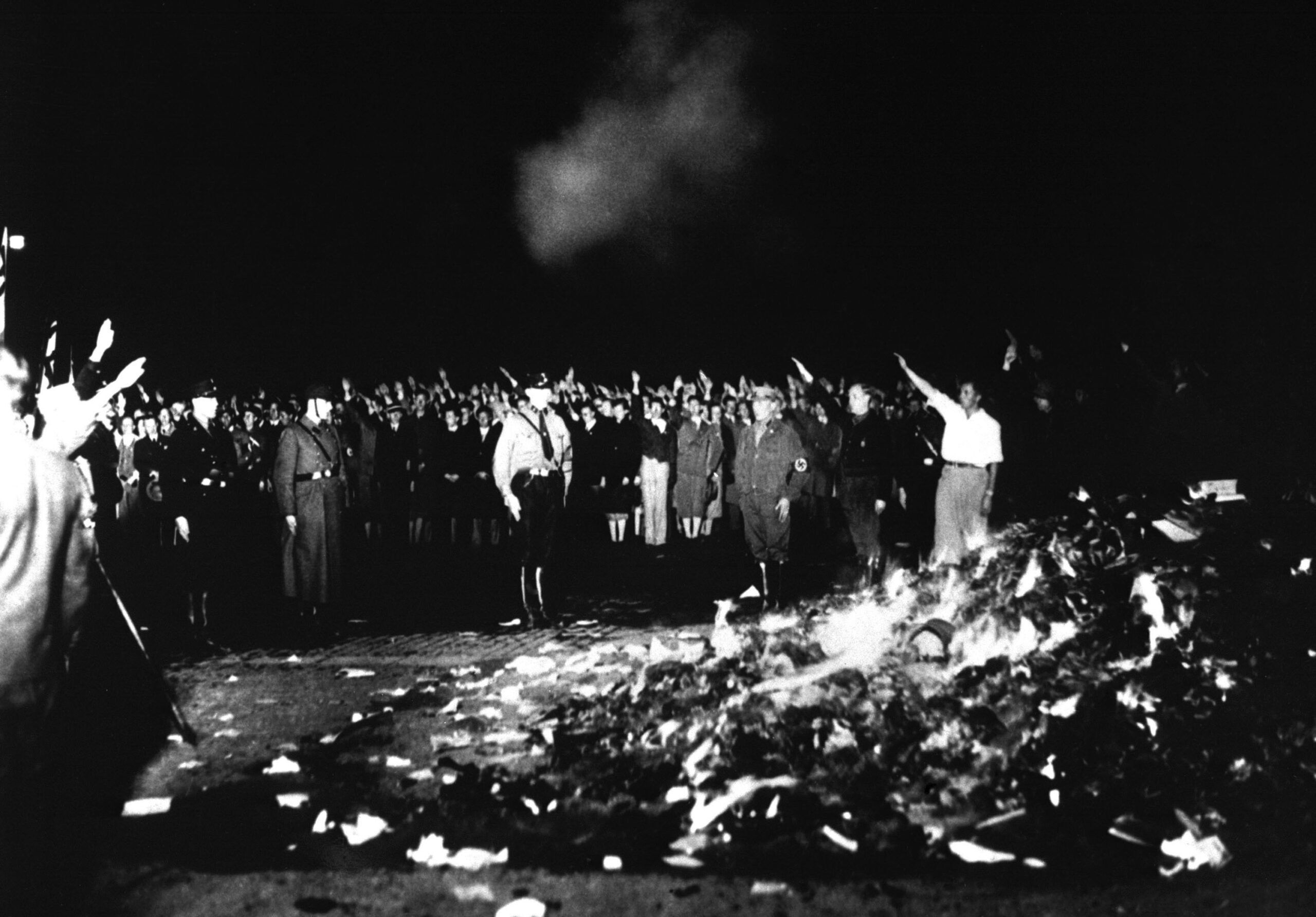 Thousands of books smolder in a Nazi bonfire, 1933. The burnings were conducted by the German Student Association of Nazi Germany.