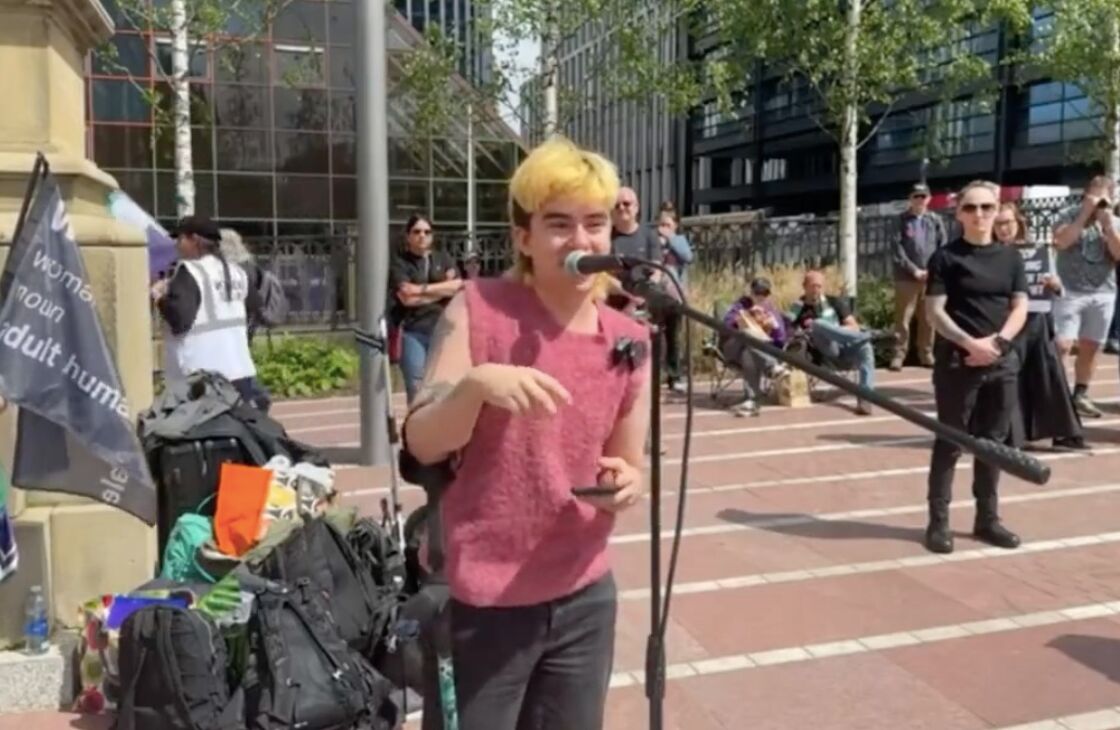 Trans man hijacks microphone at anti-trans rally & calls attendees “f**king TERFs”