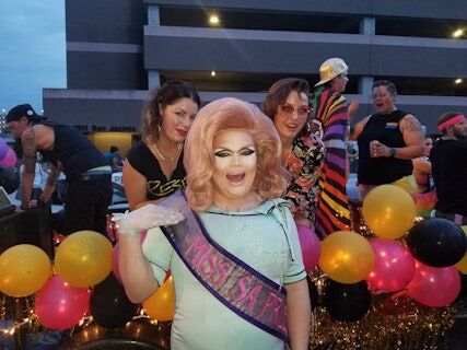 a drag queen poses for the camera at San Antonio Pride