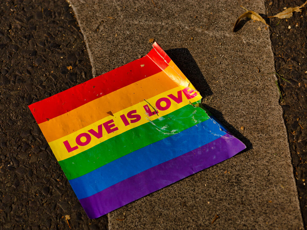 A tattered rainbow flag