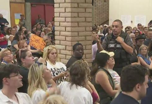 School board meeting descends into chaos as people debate outing trans kids to their parents