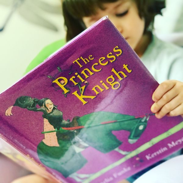 A child reads The Princess Knight