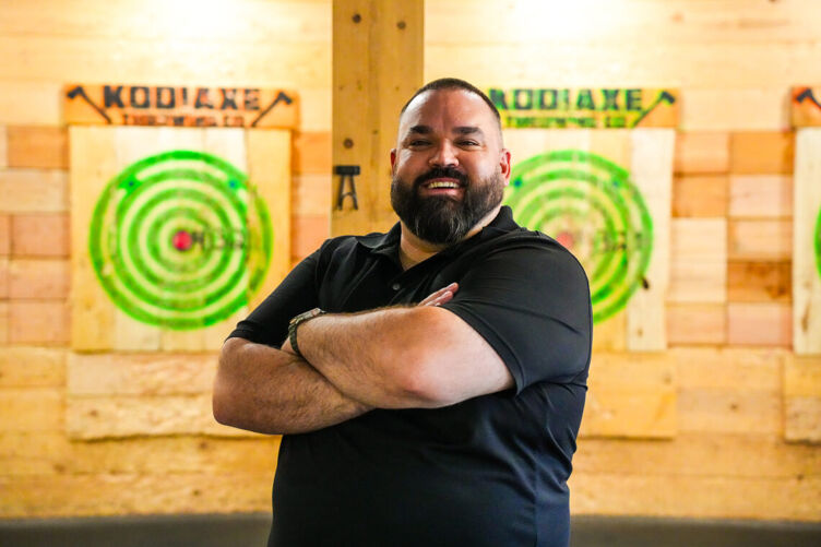 Marcus Deans at Kodiaxe, his axe-throwing  venue in Grand Junction, Colorado