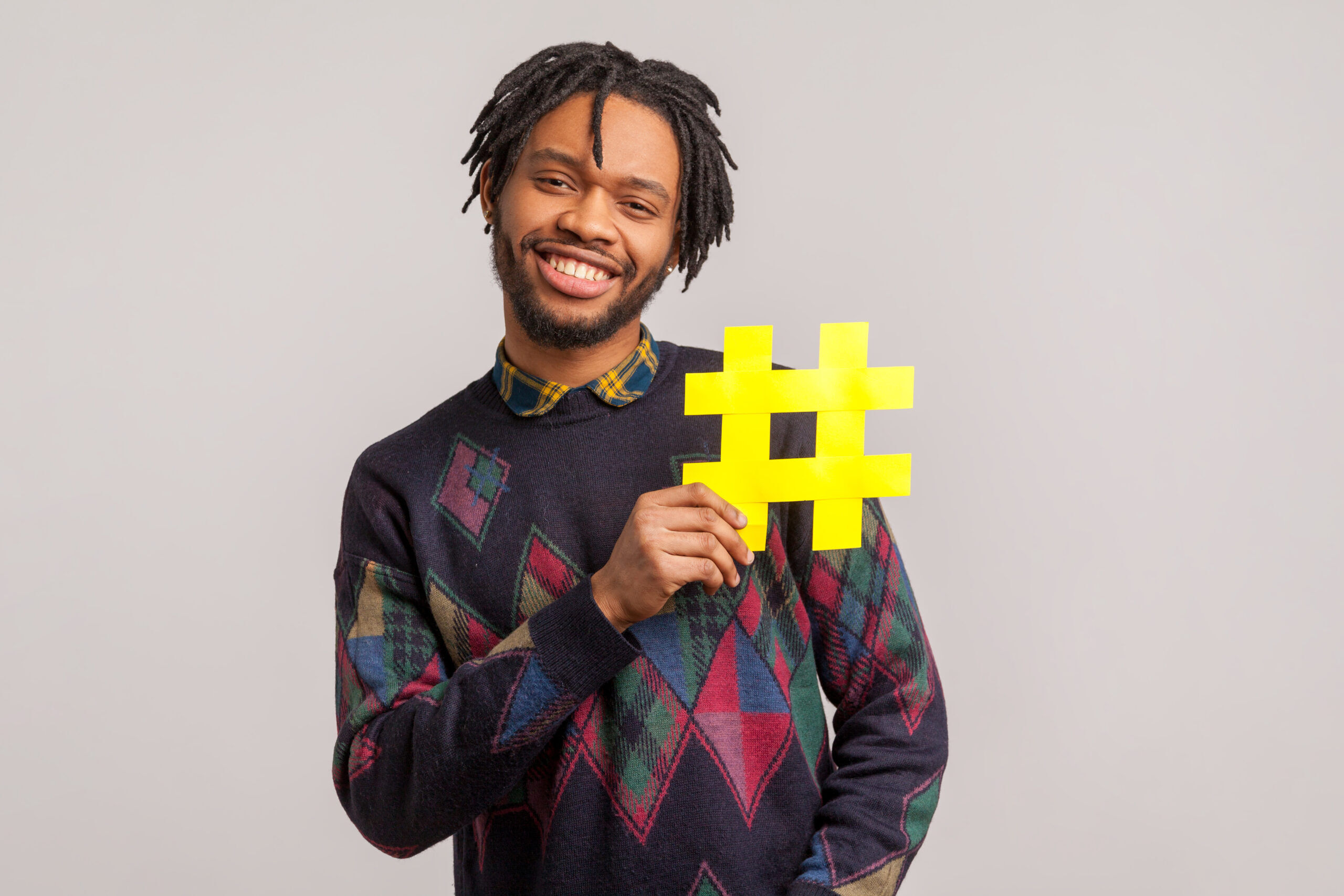 Man holding a hashtag symbol