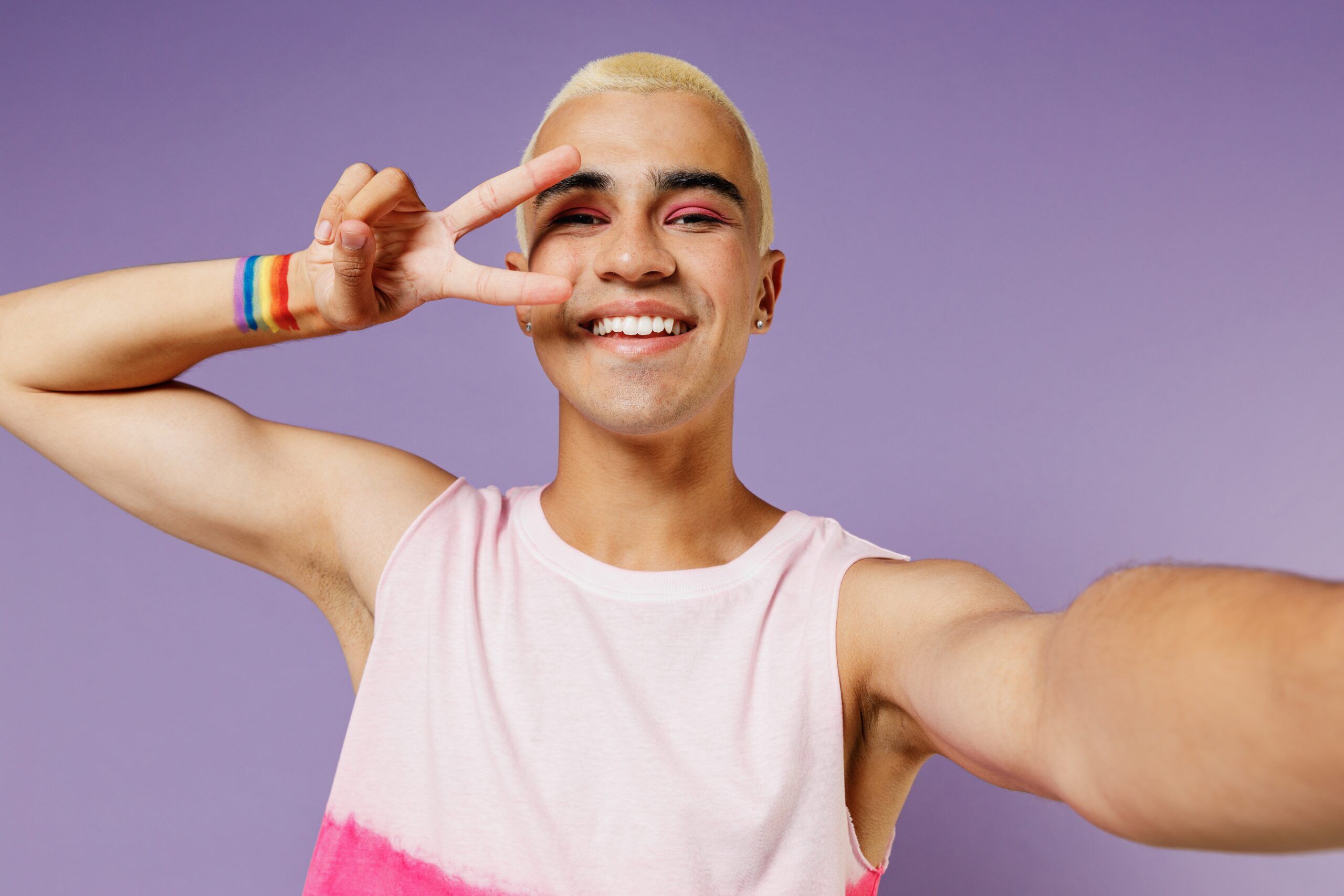 Young person with rainbow on arm