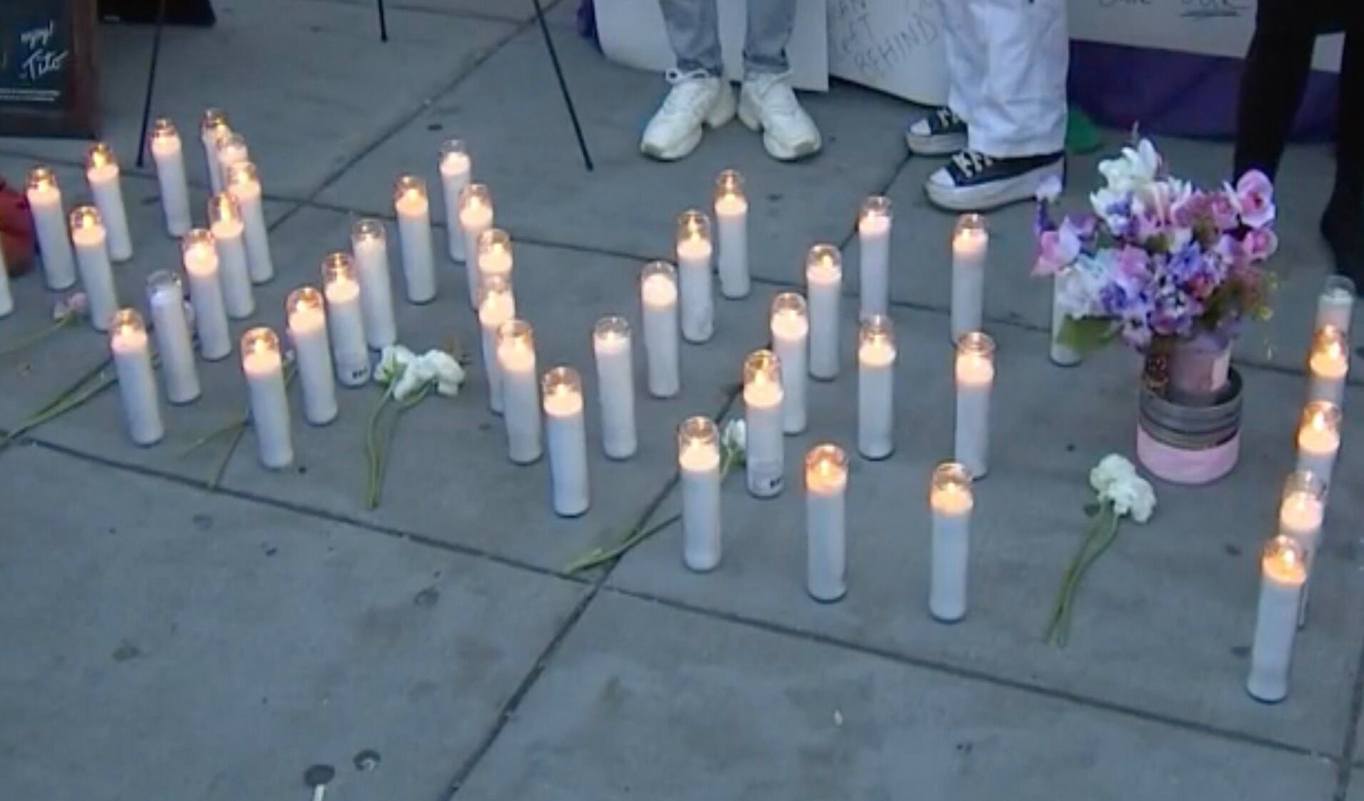 Candles spell A'nee at a vigil for Black trans woman A'nee Roberson