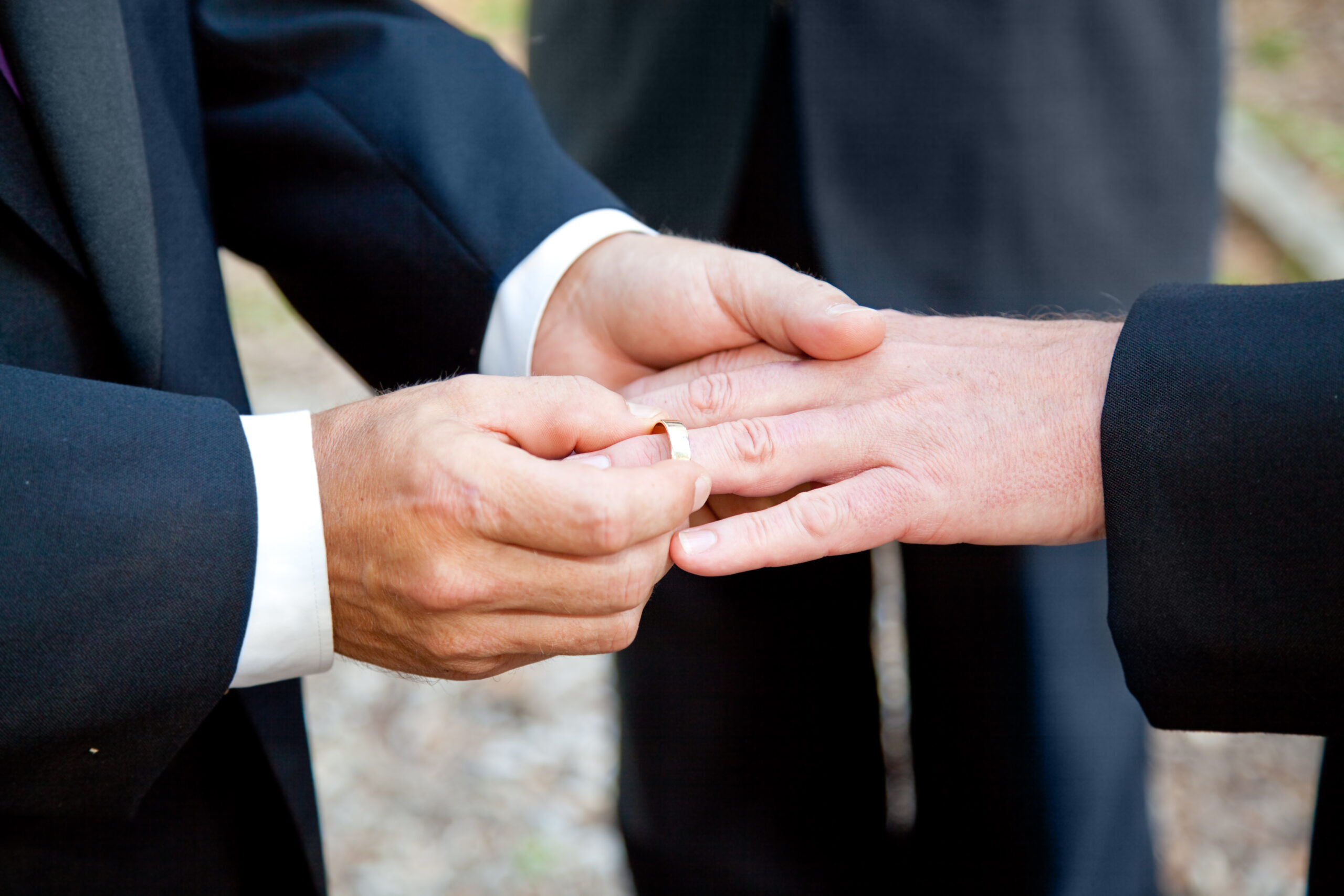 men exchanging wedding rings