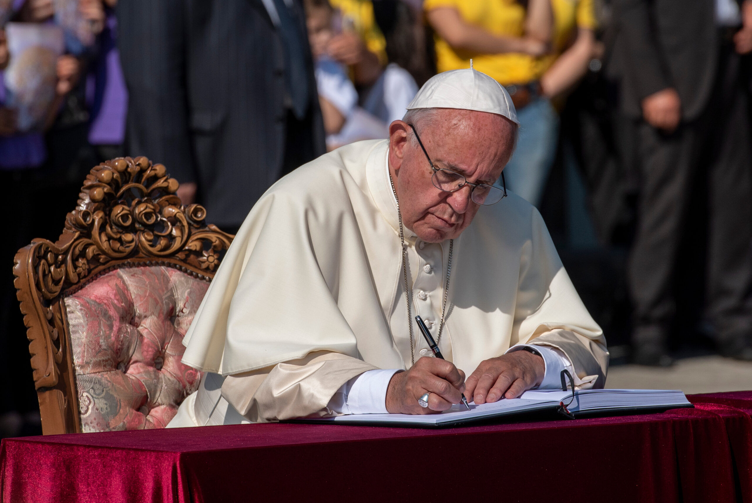 YEREVAN, ARMENIA - JUNE 25, 2016 Pope Francis writes a note in the Honorable Visitors' Book, during his visit to the Tsitsernakaberd Armenian Genocide Memoril