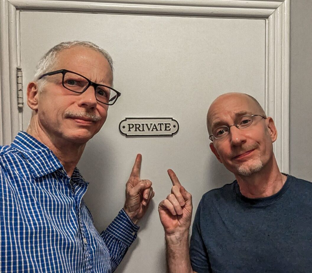 The couple standing in front of a door marked "Private"