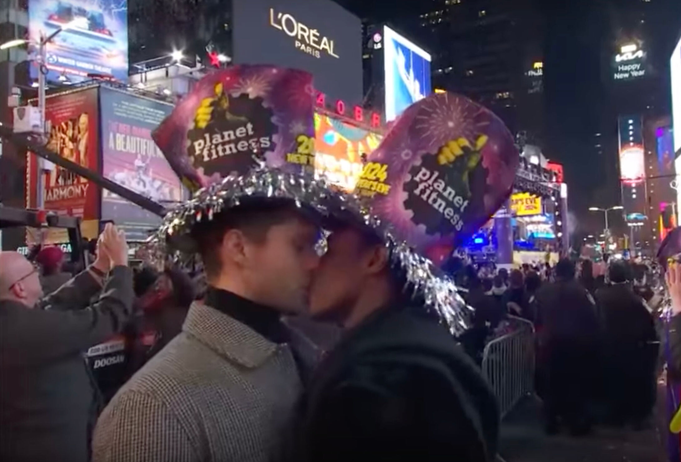 CNN's cameras caught two men kissing at the stroke of midnight on New Year's Eve.