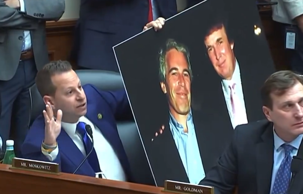 Rep. Jared Moskowitz holding up a picture of Donald Trump and Jeffrey Epstein
