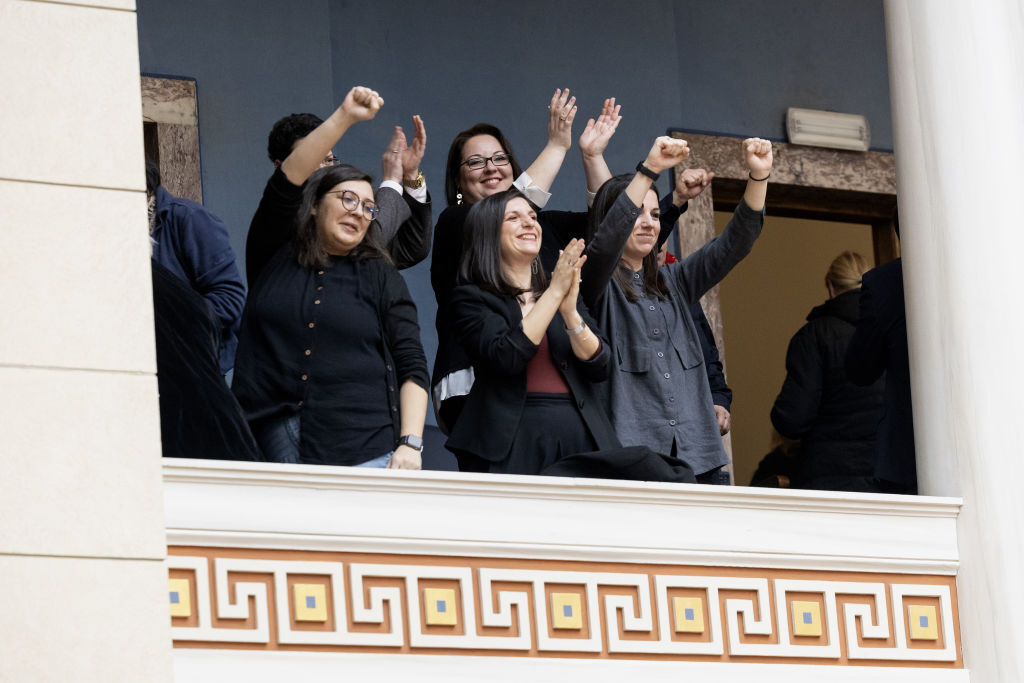 Visitors react after a vote on the same-sex marriage bill in parliament in Athens, Greece, on Thursday, Feb. 15, 2024. Greek lawmakers approved landmark legislation on Thursday to introduce same-sex civil marriage and establish equal parental rights for same-sex couples in the face of opposition from the Orthodox Church.