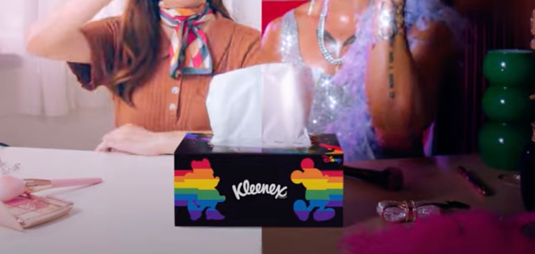 A black Kleenex box with a rainbow mickey mouse on each side