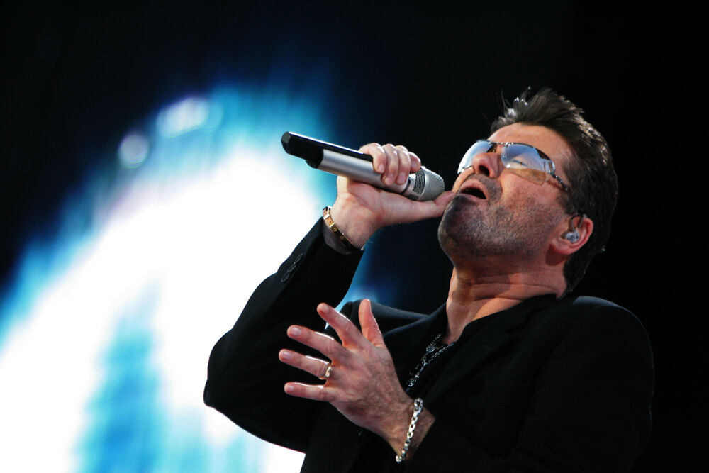 George Michael performing at a concert
