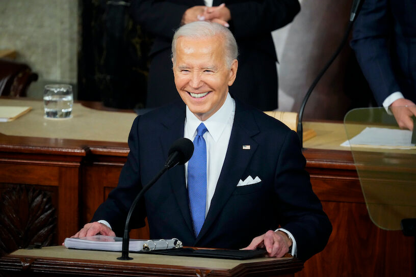 Mar 7, 2024; Washington, DC, USA; President Joe Biden smiles before delivering the State of the Union address to Congress at the U.S. Capitol in Washington March 7, 2024. Left is Vice President Kalama Harris, right is Speaker of the House Mike Johnson (R-La) Mandatory Credit: Josh Morgan-USA TODAY