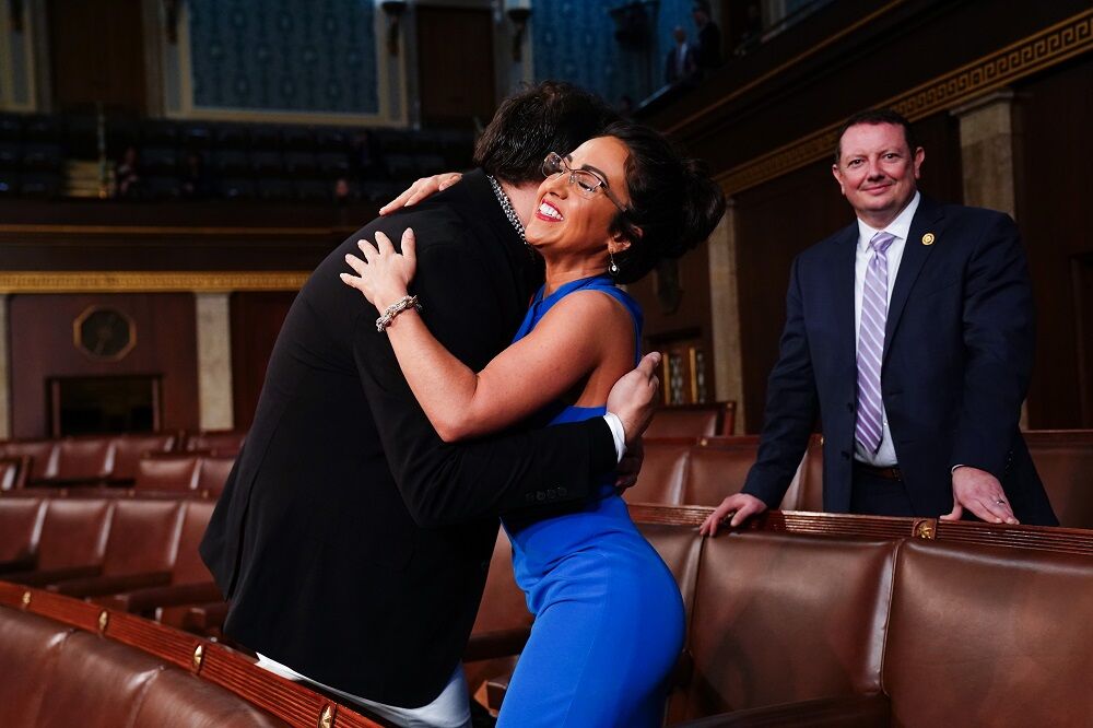Mar 7, 2024; Washington, DC, USA; Former Republican Representative from New York George Santos (L) hugs Republican Representative from Colorado Lauren Boebert (R)
