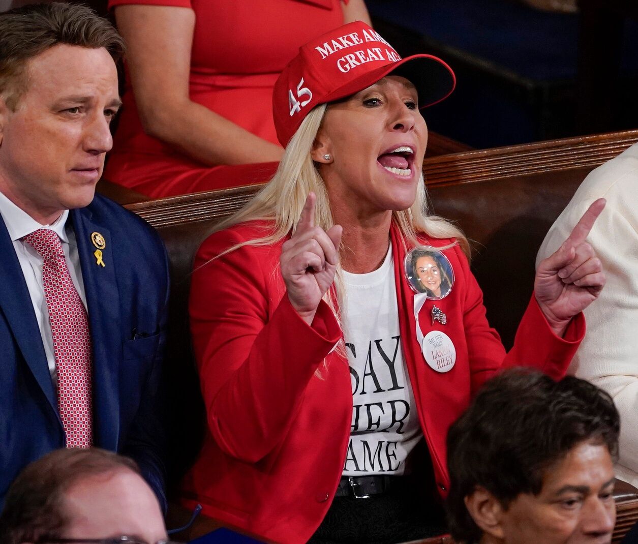 Rep Marjorie Taylor Greene (R-GA) yells as President Joe Biden delivers the State of the Union address