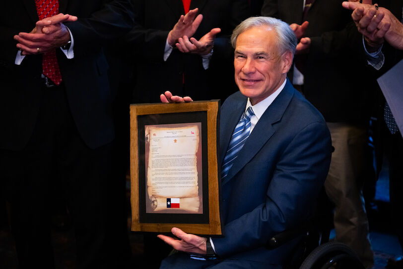 Mar, 20, 2024, Austin, TX, USA; Texas Governor Greg Abbott holds a letter from over 100 sheriffs from counties across Texas during a meeting between the governor and the sheriffs at the Texas State Capitol. Mandatory Credit: Sara Diggins-USA TODAY NETWORK