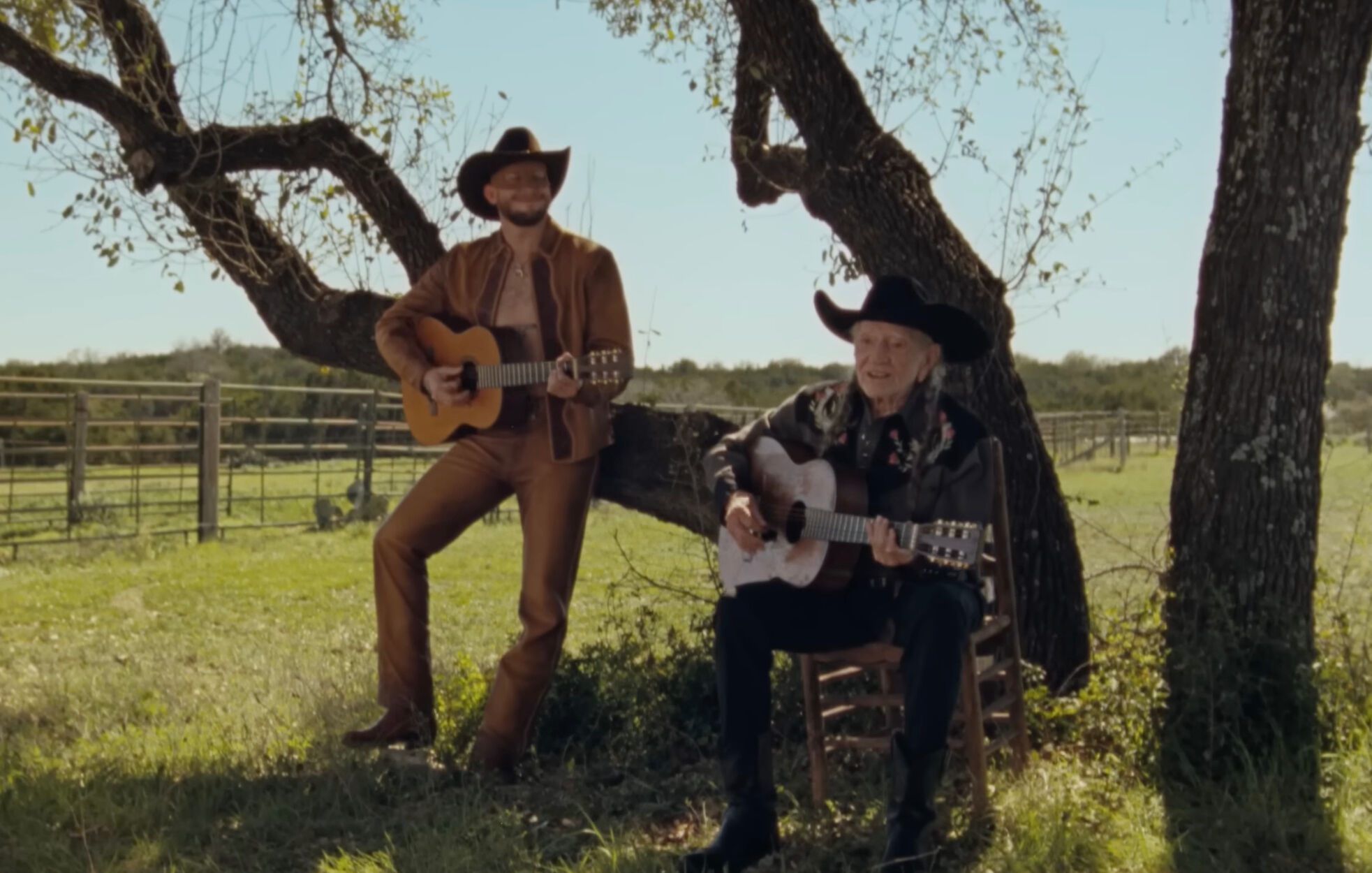 Orville Peck and Willie Nelson in the video for "Cowboys Are Frequently, Secretly Fond of Each Other."