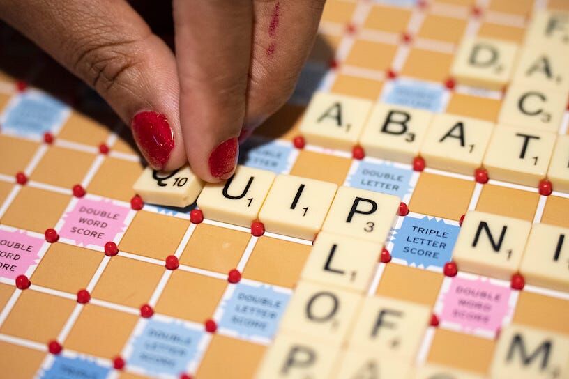 Feb 10, 2023; New Albany, Ohio, United States; Ciera Thomas plays scrabble with her husband Nick Thomas, who she met at Miami University, while wearing bright red fingernail polish in their home on Friday night. The fingernail polish, along with a green one, was left over from Christmas, Thomas said, ‚Äúbut green doesn‚Äôt go with the Miami stuff.‚Äù Mandatory Credit: Joseph Scheller-The Columbus Dispatch News Ceb Alumni Couples